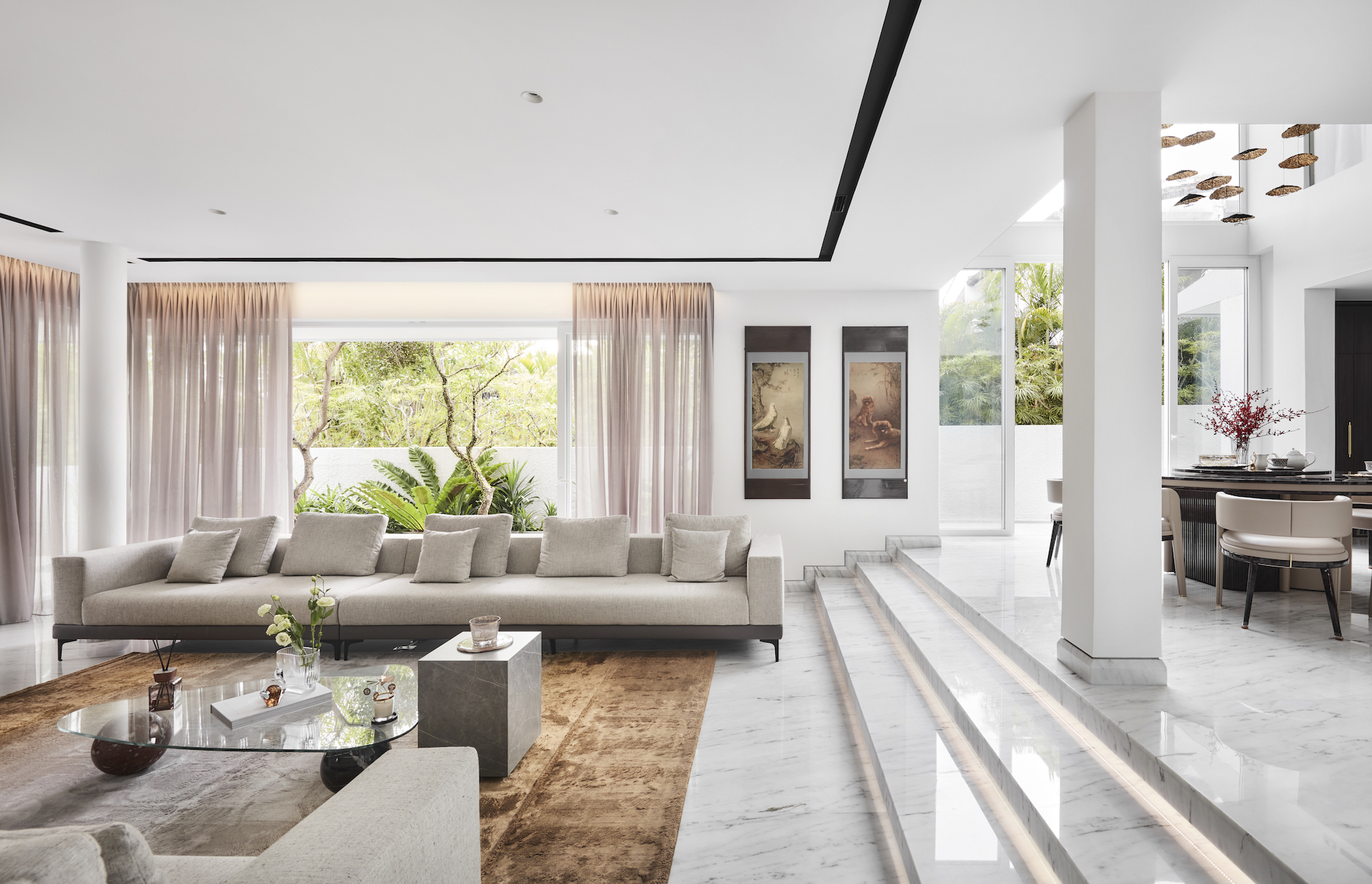 A modern living room with marble floors and white furniture.