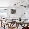 A dining room with a glass table and chairs.