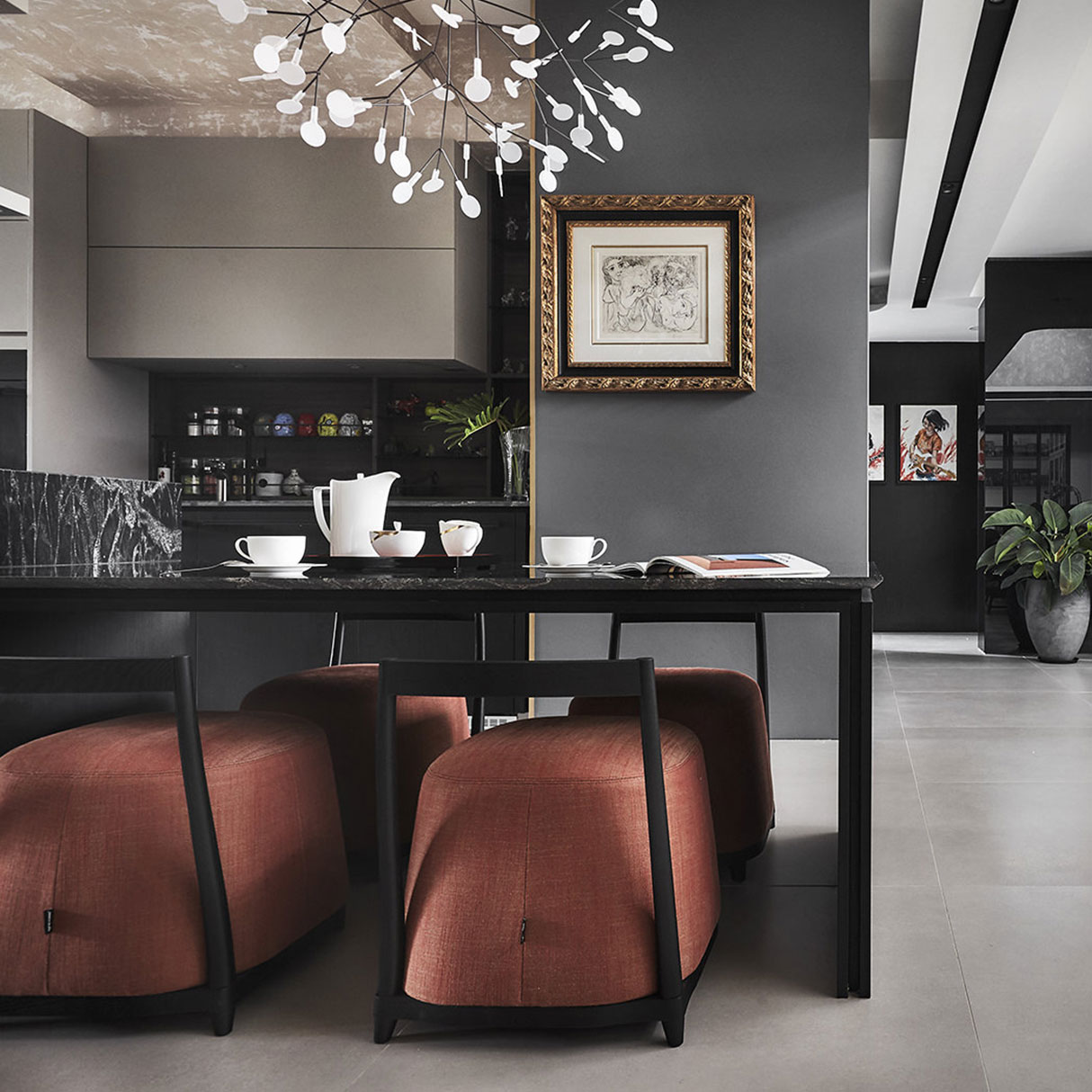 A black and white kitchen with a table and chairs.