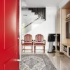 red door colour entrance way house home wooden chair