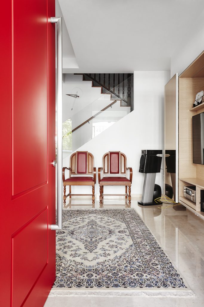 red door colour entrance way house home wooden chair