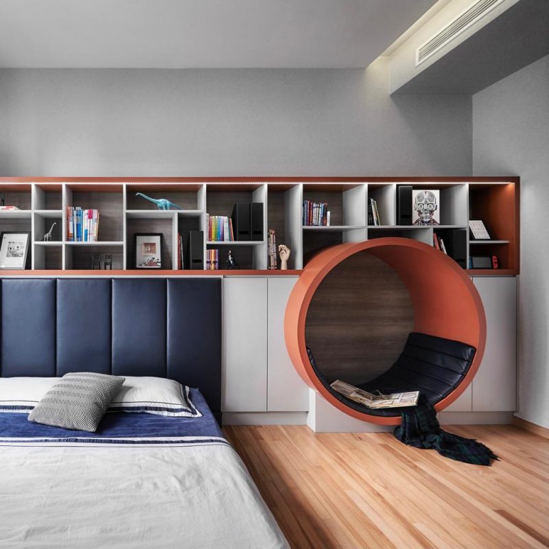 A bedroom with a bed and a bookcase.