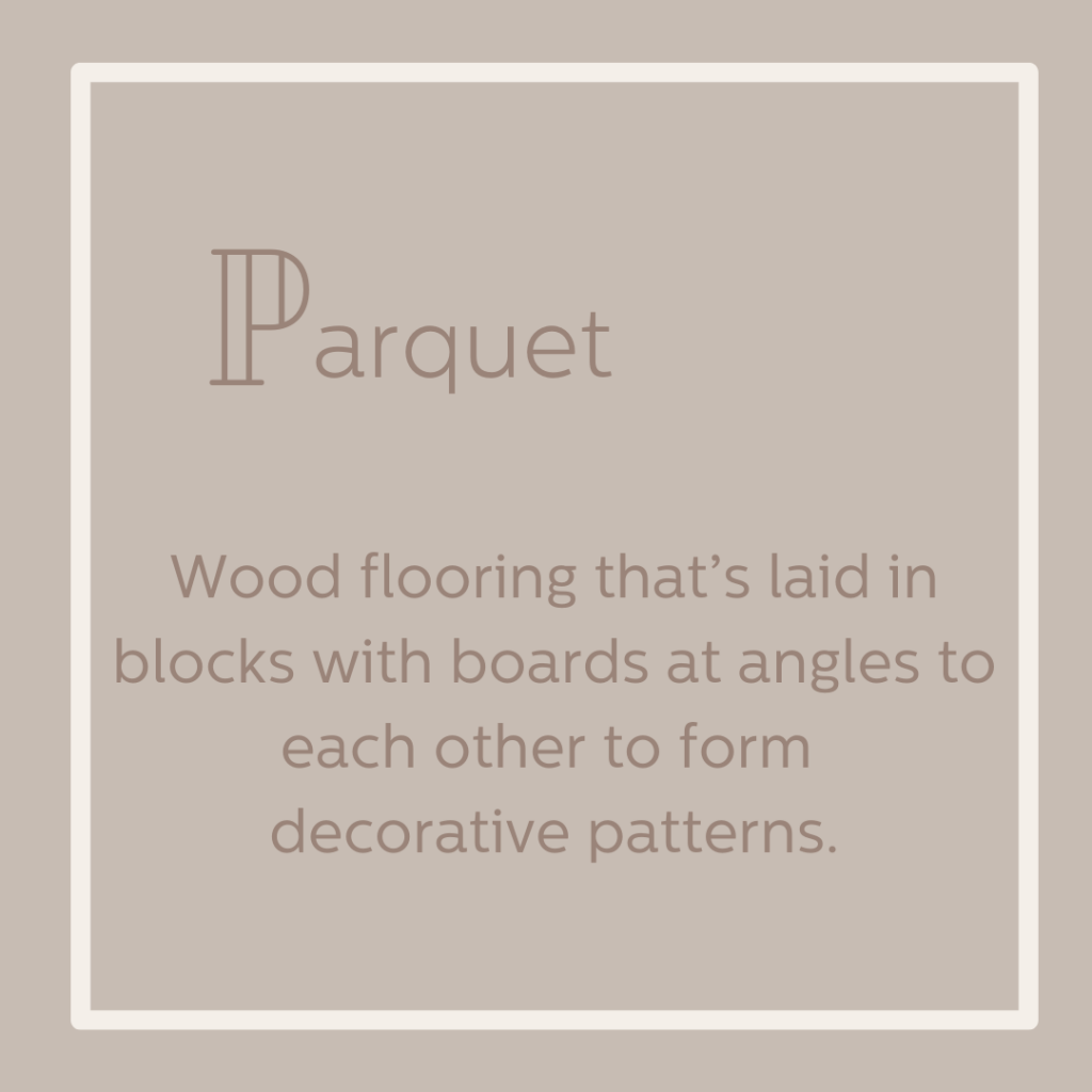 Parquet wood flooring that's laid in blocks with boards at angles to form decorations.